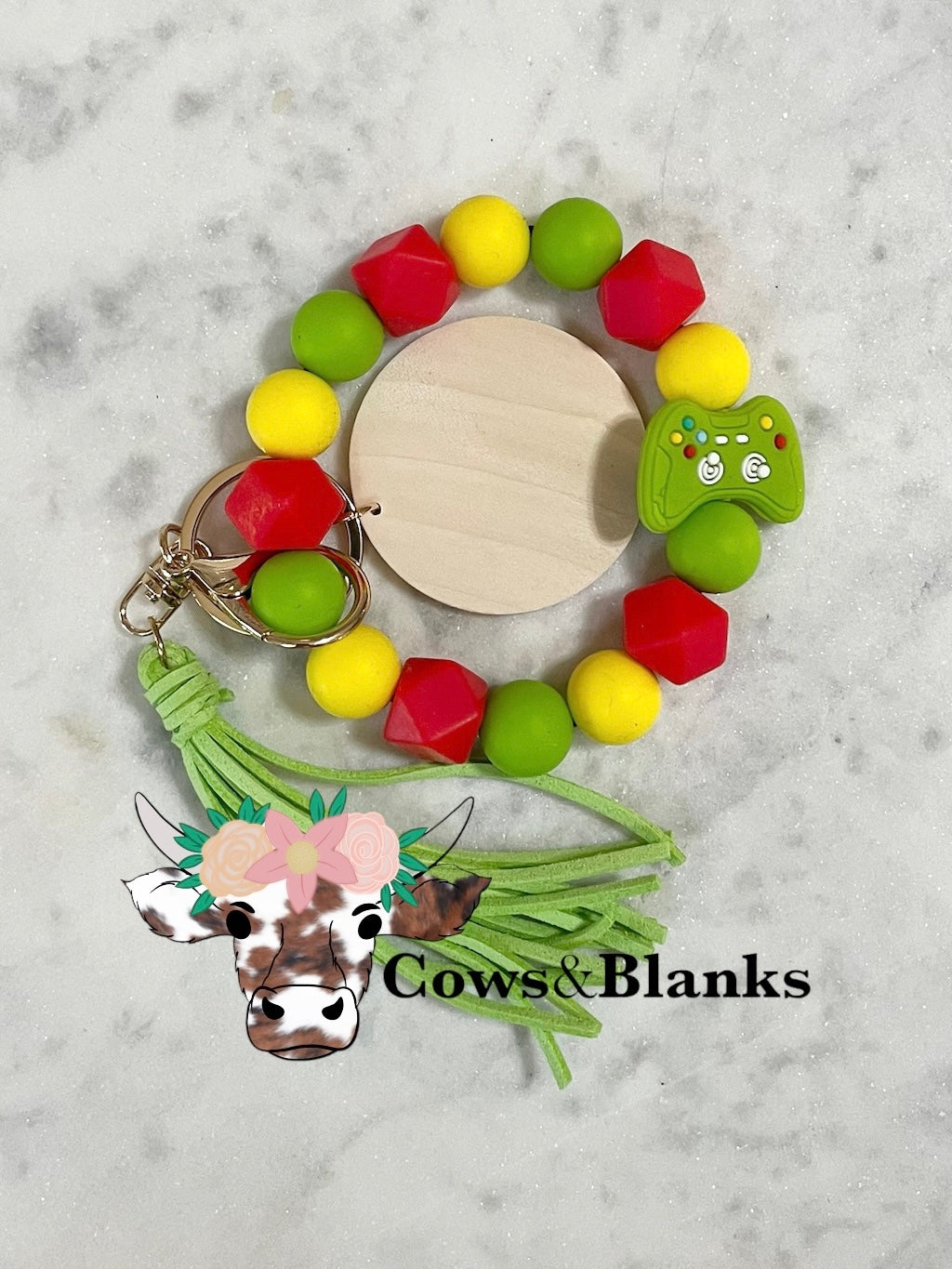 Gamers Delight Wristlet with Game Controller Silicone Bead. Happy Colors of Red, yellow, and Lime Green Beads with a Wooden Disc, Tassel, and Gold Hardware