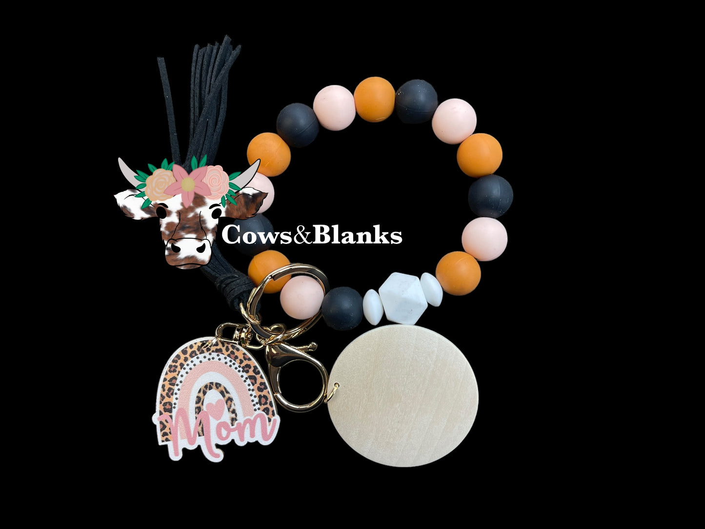 Mom's Trio of Soft Pink, Terracotta, and Black Silicone Stretch Beaded Wristlet Bracelet Keychain with a Wooden Leopard Print Rainbow Mom Charm with White Accent Silicone Beads. Wristlet has Gold Hardware, a Matching Tassel, and a Wooden Disc