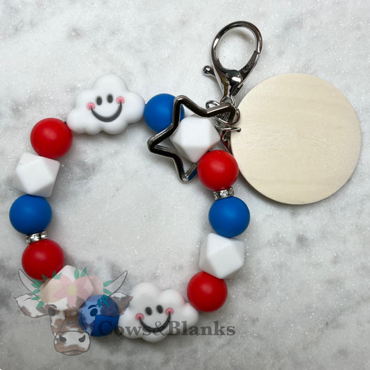 Happy Clouds Patriotic Silicone Beaded Stretch Wristlet Bracelet Keychain with Wooden Disc and Tassel