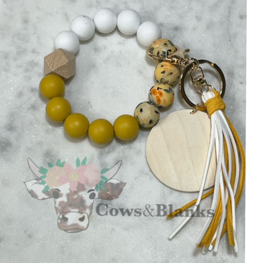 Mustard Flowers: Yellow Floral Silicone Stretch Beaded Wristlet Bracelet Keychain with Wooden Disc and Tassel