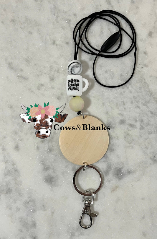 COFFEE TEACH REPEAT ON A CUP SHAPED SILOICONE BEAD WITH MARBLE YELLOW FADING INTO PINK BEADS TEACHER LANYARD.