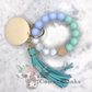 Marbled Pastels and Grays Stretch Silicone Wristlet Bracelet Keychain with Wooden Disc and Tassel